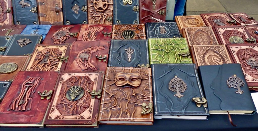 Notebooks with raised magical imagery on the front cover.