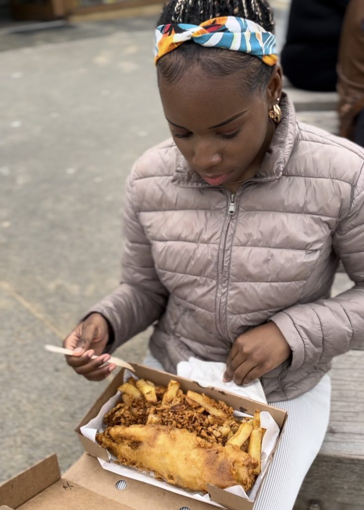 Girl eating fish and chips